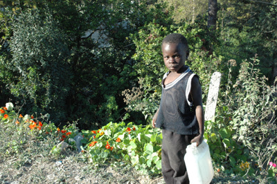 A little boy on the way to fetch water